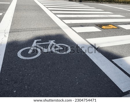 Bike lane on the road  Royalty-Free Stock Photo #2304754471