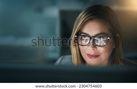 Glasses, serious and business woman at night on a computer or working late or editor for a project deadline and in an office. Research, email and overtime or corporate worker or analysis and on pc