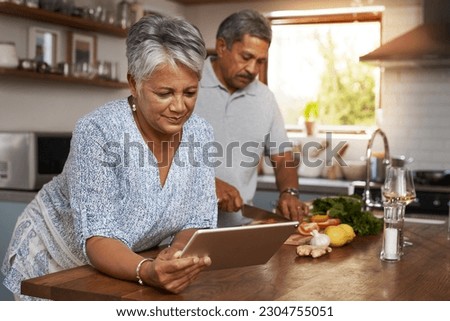Senior couple, tablet and cooking in kitchen with healthy food, online search and app for nutrition in home. Digital recipe, old woman and man in house with meal prep, wellness and retirement diet.