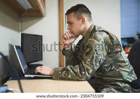 Laptop, thinking and military man with security software, online research and law academy in office. Planning, soldier or young army person on computer, internet search or website information check Royalty-Free Stock Photo #2304755109