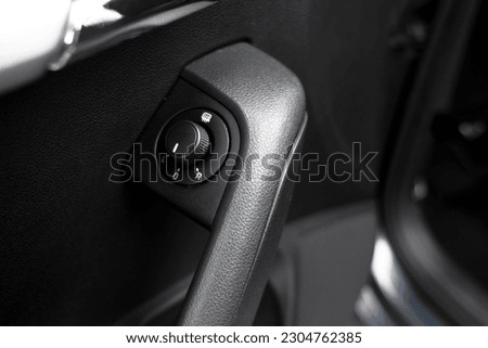 The modern interior of the car is black. Interior details.