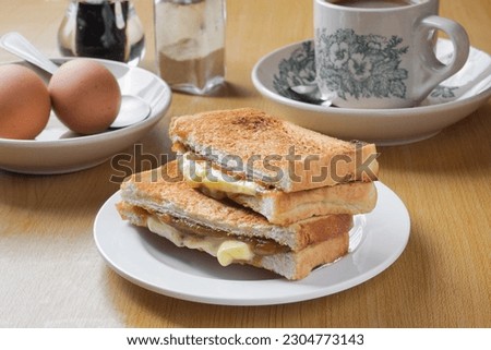 Kaya toast butter. Traditional oriental and vintage kopitiam breakfast style. Popular in Malaysian and Singaporean. Royalty-Free Stock Photo #2304773143