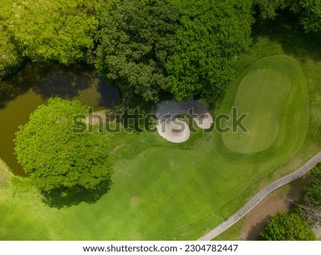 Aerial photograph of a golf course on a sunny day. - stock photo