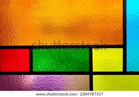 Background of a vivid colored stained glass rectangle design Royalty-Free Stock Photo #2304787317
