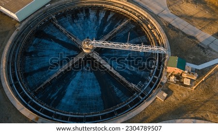 Aerial view of an empty secondary clarifier for a waste water treatment plant Royalty-Free Stock Photo #2304789507