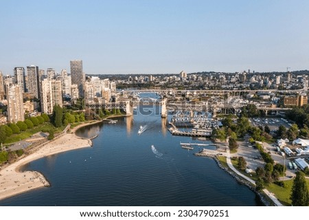 Aerial view of area around False Creek with Granville Street Bridge, Burrard Street Bridge and False Creek Harbour in Vancouver, Canada with boats on water