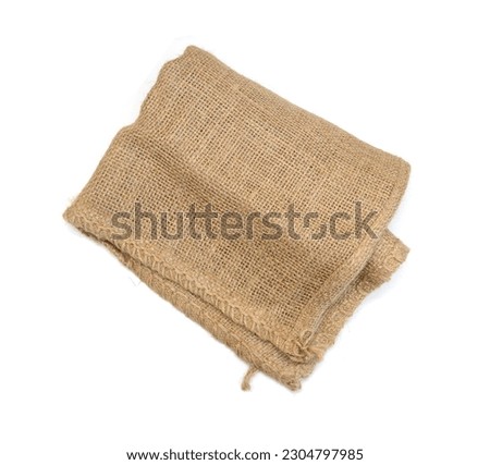 Hessian sack with ties forming over white background.  Royalty-Free Stock Photo #2304797985
