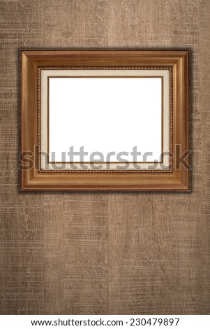 Old picture frame on vintage wood wall.