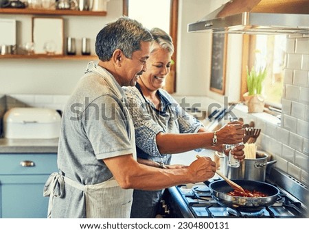 Help, cooking together and old couple in kitchen with smile, health and frying healthy food at stove. Love, senior man helping happy woman prepare lunch and meal in pan, retirement and dinner in home Royalty-Free Stock Photo #2304800131