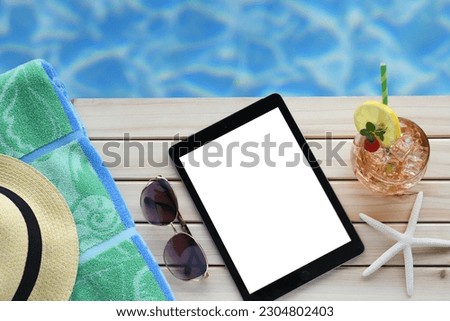 Summer vacation beach blank screen ipad e-reader mock up. Royalty-Free Stock Photo #2304802403