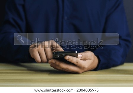 Searching internet information with search bar, hand of businessman working on computer laptop