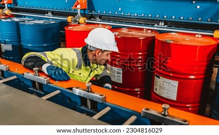 Metal roofing mechanic virtually inspect condition of workpieces, machinery supplies, chemical tanks. Examine the signs of wear, issues, damage and defects. Heavy metal sheet lifting and relocation. Royalty-Free Stock Photo #2304816029