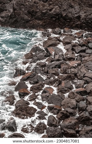 photo of sea water bursting on the rocks, Madeira Island