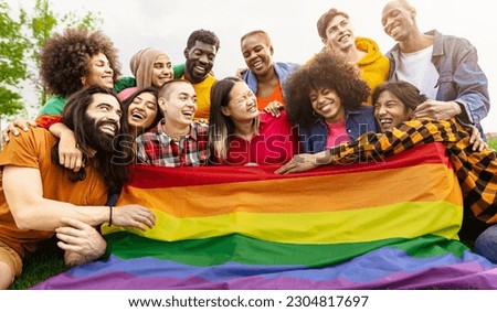 Happy diverse young friends celebrating gay pride day - LGBTQ community concept Royalty-Free Stock Photo #2304817697