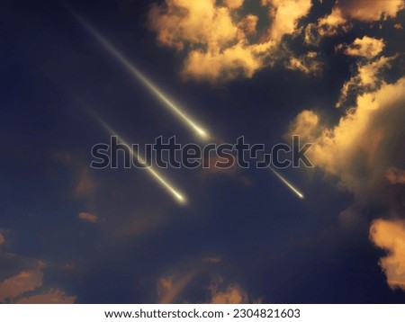 Three fireballs in the sky at sunset. Shooting stars in the light of the sun. Meteor glow.