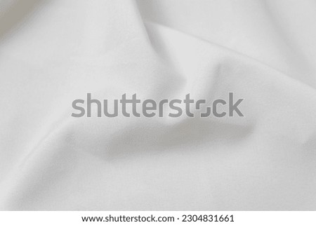 Mauled off-white colored fabric texture background. This fabric is made of polyester and spandex. Royalty-Free Stock Photo #2304831661