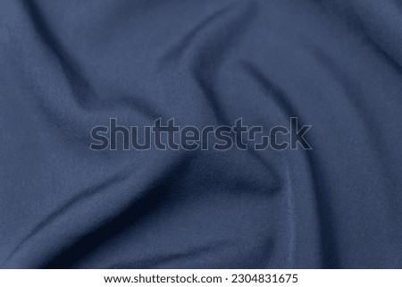 Mauled indigo blue colored fabric texture background. This fabric is made of polyester and spandex. Royalty-Free Stock Photo #2304831675