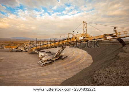 Machinery stacking copper sulfide deposits at a copper mine in Chile Royalty-Free Stock Photo #2304832221