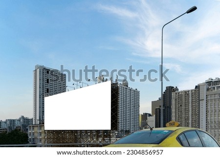 Large empty billboard ads along city highways on the background of a blue sky with beautiful clouds can be used for product display. Outdoor advertising posters for city streets, promotional posters.