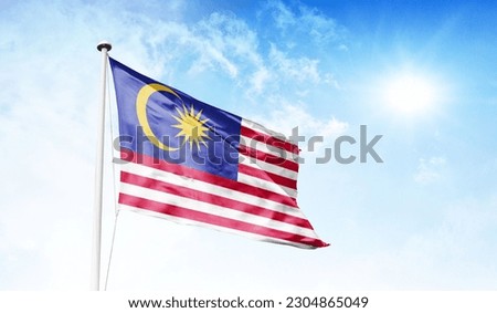 malaysia flag waving on a high quality blue cloudy sky