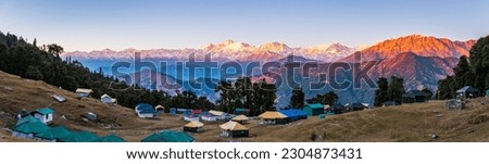 Panoramic view from Chopta camping location. Chopta is a base for trekking to Tungnath-Chandrashila, It is a famous peak in the Himalayan ranges in Uttarakhand state of India. Royalty-Free Stock Photo #2304873431
