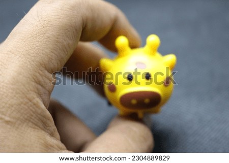 Baby toys, yellow cute baby figure, small and cute.