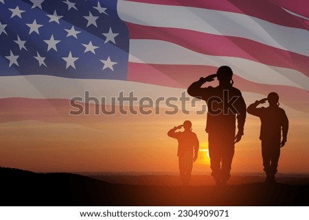 Silhouettes of soldiers saluting on background of sunset or sunrise and USA flag. Greeting card for Veterans Day, Memorial Day, Independence Day. America celebration. Royalty-Free Stock Photo #2304909071