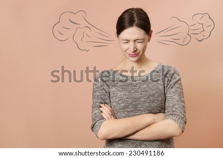 Portrait of angry young woman, Portrait of angry young woman with steam coming out of her ears -  Negative human emotions