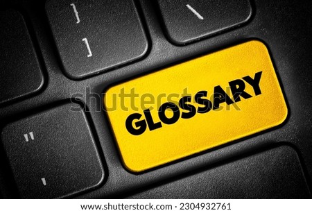 Glossary - an alphabetical list of words relating to a specific subject with explanations, text button on keyboard Royalty-Free Stock Photo #2304932761