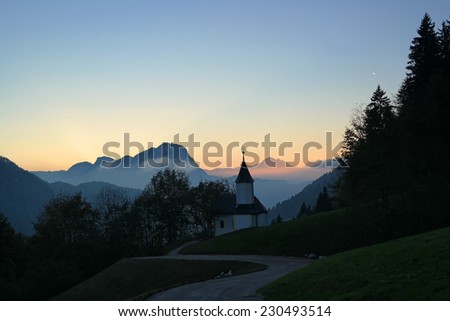 Austria, tyrolean alps, small chapel in evening twilight
