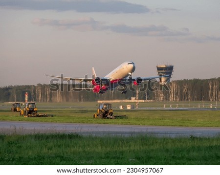 Takeoff of a Boeing 777-300 of ROSSIYA airlines from Vnukovo airport. Moscow region, Russia - July 21, 2017 Royalty-Free Stock Photo #2304957067