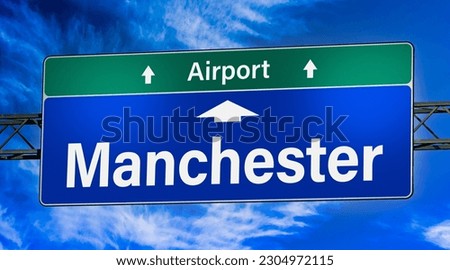 Road sign indicating direction to the city of Manchester.
