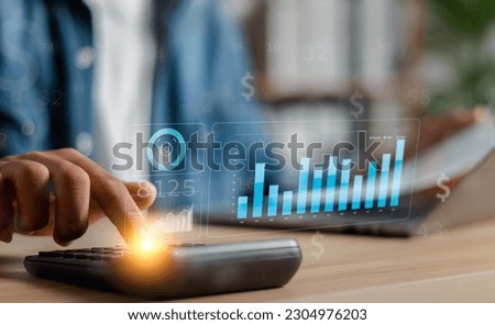 Data analysts work on business analytics dashboards with charts. Analysis of financial plans for long-term investments.