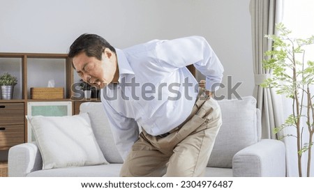 Asian man with back pain