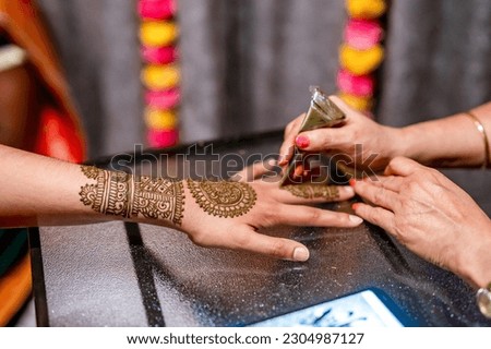 Indian bride's wedding henna mehendi mehndi hands close up Royalty-Free Stock Photo #2304987127