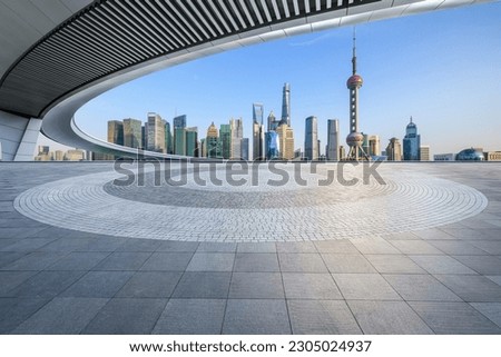 Empty square floor and city skyline with modern buildings in Shanghai, China. Royalty-Free Stock Photo #2305024937
