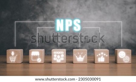 NPS, net promotor score concept, Wooden block on desk with net promotor score icon on virtual screen.  