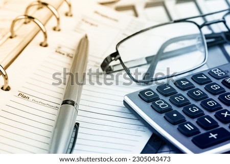 Items for accounting and business in the office on a bright colored background.