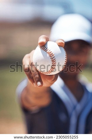 Hand holding baseball, closeup and man for sport, field and training with blurred background in sunshine. Softball player, sports and zoom of ball for training, fitness and workout for competition