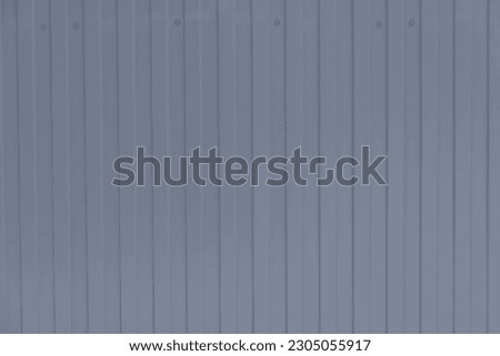 Abstract conctruction gray steel sheet background. Close-up view of corrugated galvanised iron roofing. Copy space for your text and decorations. Construction materials theme.
