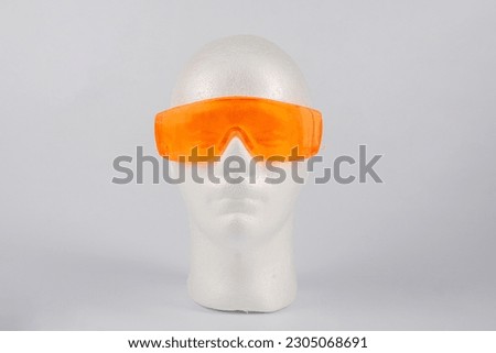 Orange sunglasses isolated on white background 