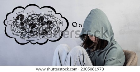 Teenage girl in depression, lonely, thinks about problems anxiety, panic in her head. The concept of adolescent psychology. Psychological problems.