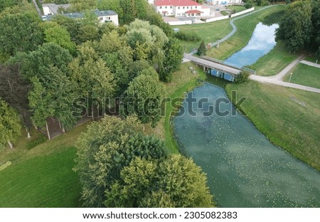 Skuodas river and park with green trees