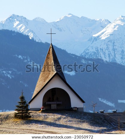 Small shrine in the winter mountains scenery