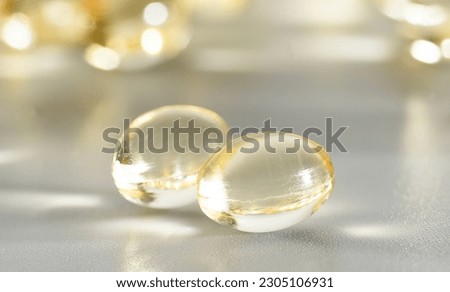 Fish Oil Omega 3 on white background, vitamin D yellow supplement gel capsules, macro shot Royalty-Free Stock Photo #2305106931