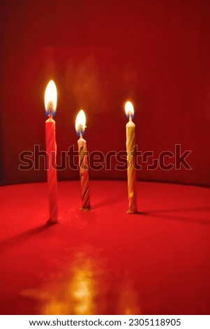 Candlelight in the dark. Burning, giving a warm light Royalty-Free Stock Photo #2305118905