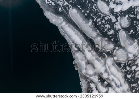Frozen lake top down drone photo - Wigry, Suwalszczyzna aerial photo, ice on water on winter