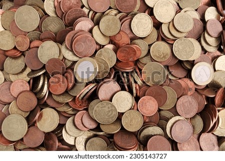 Many euro coins and cents