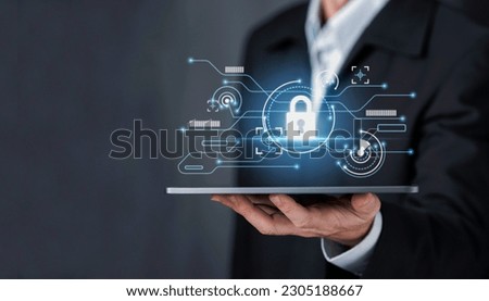 Businessman select the icon security on the virtual display tablet screen, Businessman technology privacy. Cyber security business data protection  concept.