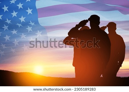 Silhouettes of soldiers saluting on a background of sunset or sunrise and USA flag. Close-up. Greeting card for Veterans Day, Memorial Day, Independence Day. America celebration. Royalty-Free Stock Photo #2305189283